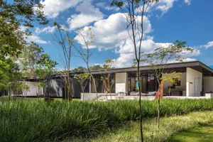 Modern house with concrete exterior and large windows