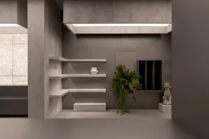 Modern interior room with concrete floating shelves, decorative plant, and minimalist decor.