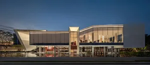 Modern architectural building with glass exterior at dusk