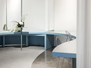 Circular glass furniture in a minimalist interior design setting.