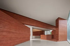 Modern interior space with wooden walls and floors.