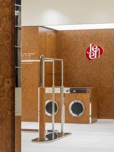 A modern laundry room featuring wooden washing machines.
