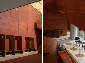 Modern restaurant interior featuring red marble walls and furniture