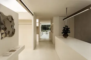 Modern minimalist interior with concrete elements, clean lines, and simplicity.