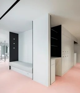 Modern minimalist office space featuring clean lines, concrete, glass, and metal materials.