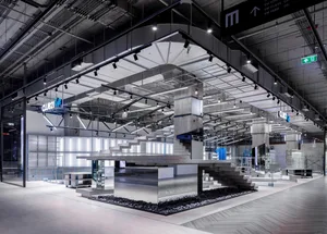A modern industrial retail space featuring concrete and steel structures.