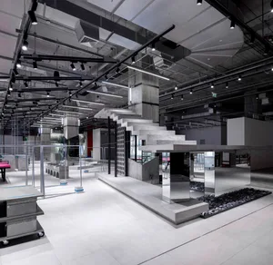 Modern office with concrete finishes and sleek, minimalist design.