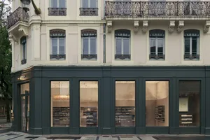 Modern storefront with glass facade showing interior space.