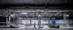 Modern, industrial-style retail space featuring concrete and glass materials.