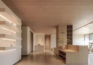 A minimalist spa reception desk made of wood.
