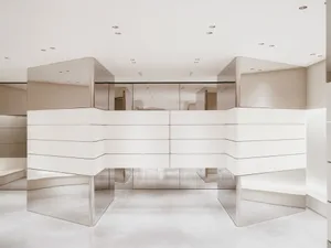 Modern minimalist storefront with polished concrete walls and floor.