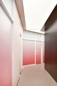 A modern interior design featuring a corridor with glass doors and a gradient color scheme.