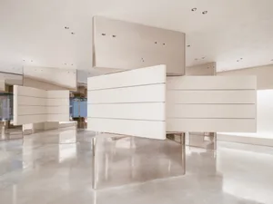 A minimalist, modern interior design featuring sleek, metallic panels.