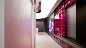 A digital space display featuring vibrant pink and purple colors and geometric patterns.