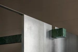Modern interior design featuring a combination of marble and concrete materials.