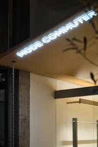 Modern storefront signage featuring metallic letters