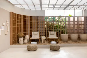 A serene relaxation zone featuring wooden elements and plants.