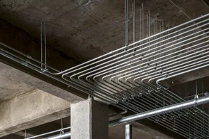 Pipes and columns in an industrial construction site.