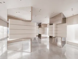 A sleek, modern storefront featuring metallic surfaces and minimalist design.