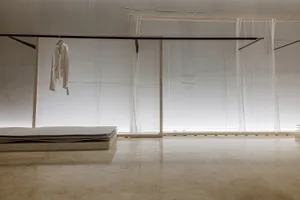 Minimalist installation featuring sheer fabric on a framework