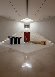 A modern interior space featuring concrete architecture and minimalist design elements.