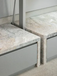 Modern kitchen cabinets with marble countertops.
