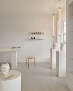 Modern retail store with concrete furniture and minimalist design
