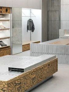 Modern retail storefront with polished concrete walls and floors, showcasing minimalist design