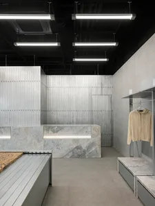 A modern retail storefront with metal cladding and minimalist design.