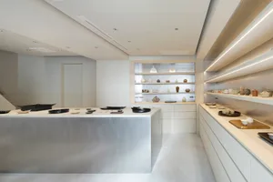 Ceramic workshop with industrial design elements and artisanal ceramic displays.