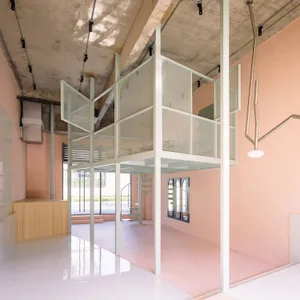 A modern interior space with concrete, glass, and metal materials.