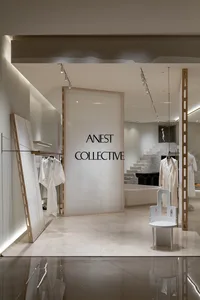 Modern retail storefront with glass walls and cement accents