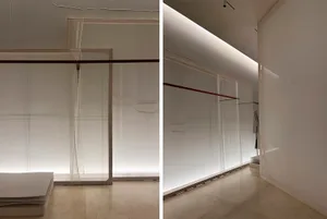 White architectural interior design featuring sheer curtains and soft lighting.