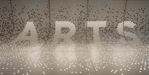 A minimalist interior design featuring a metallic mesh material