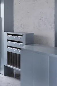 Metal storage furniture with multiple compartments and a countertop.