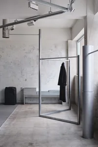 Modern industrial clothing store with minimalist design