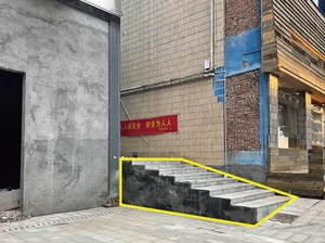 Urban exterior featuring a set of concrete stairs with a yellow line emphasizing the stairs.