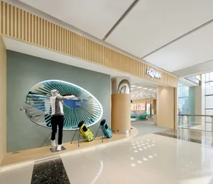 A modern retail storefront featuring metallic elements and a sleek, contemporary design.