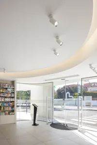 Modern design interior of a retail storefront with a glass storefront and minimalist decor.