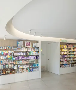 Modern baby shop interior with organized shelves displaying products.