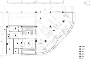 Floor plan of a business center with various functional areas and outdoor seating.