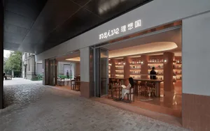 Neutral-toned minimalist interior of a coffee shop with a modern design.