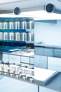 An image showcasing a sleek, modern commercial kitchen with metallic elements.