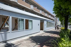 Modern commercial building with large windows and minimalist design.