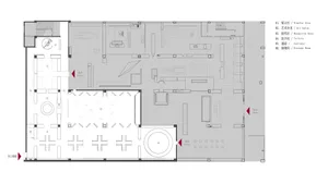 Floor plan of a modern office space showing various functional zones such as reception area, restrooms, corridors, and storag