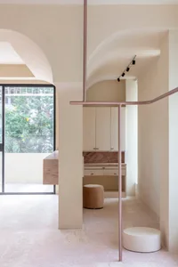 Modern living room featuring minimalist design with neutral tones and natural light.
