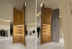 Modern retail storefront with wooden shelves and lighting.