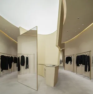 Modern retail clothing store with neutral tones and minimalist design