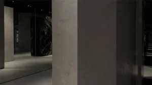 Modern industrial interior space featuring exposed concrete walls and floors.
