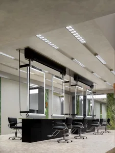 A modern hair salon featuring a sleek, concrete interior design.